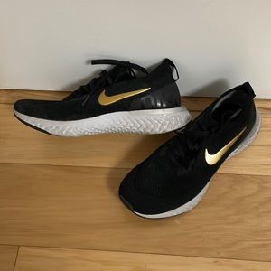 Nike Epic React black and gold sneaker
